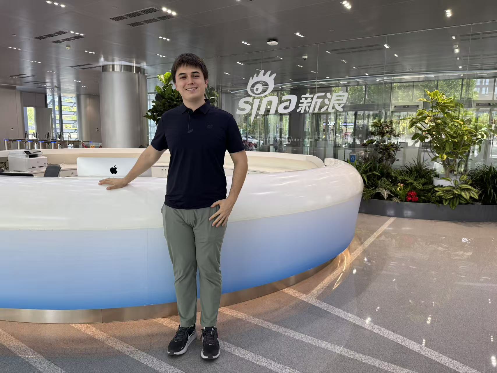 Chris standing in the Weibo (Sina) office lobby in Beijing